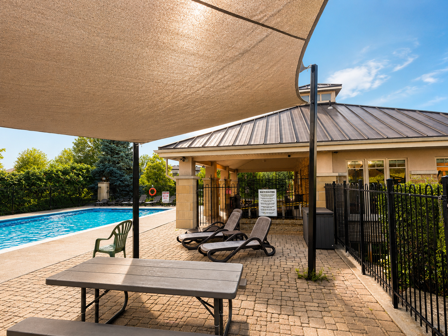 The pool house and shaded lounging